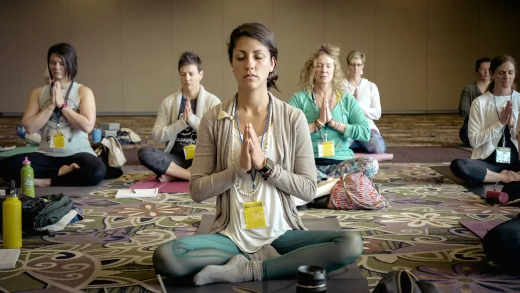 group of women meditating