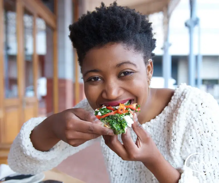woman eating food - unhealthy eating cycle